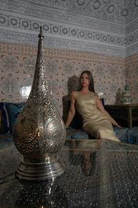 Portrait of young woman sitting at temple