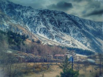 Scenic view of snowcapped mountains against sky