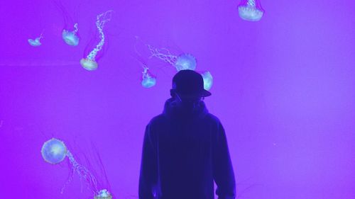 Low angle view of hands at night