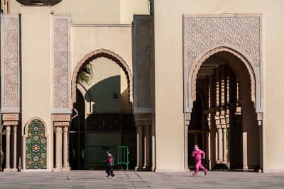 People walking in historic building