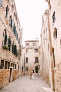 Alley amidst buildings in city