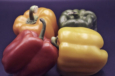 Close-up of yellow bell pepper against colored background