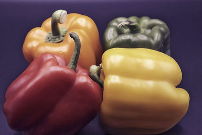 Close-up of yellow bell pepper against colored background