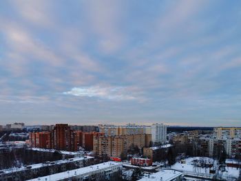 High angle view of buildings in city against sky