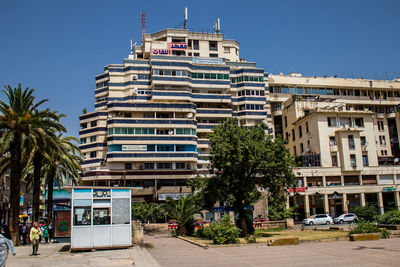 Buildings in city against clear sky