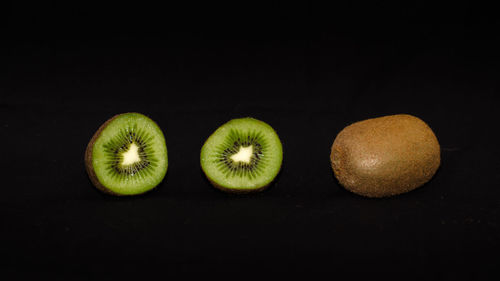 Close-up of green object over black background