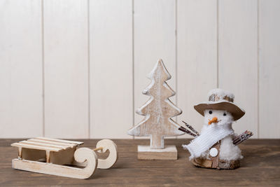 Close-up of christmas decorations on wooden table