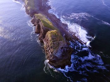 High angle view of rock formation in sea