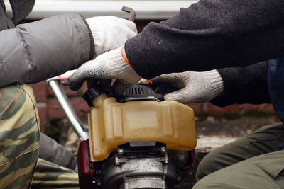 Midsection of man working at bus