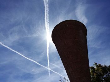 Low angle view of vapor trail against sky