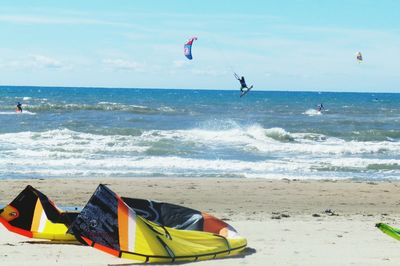 People surfing on beach