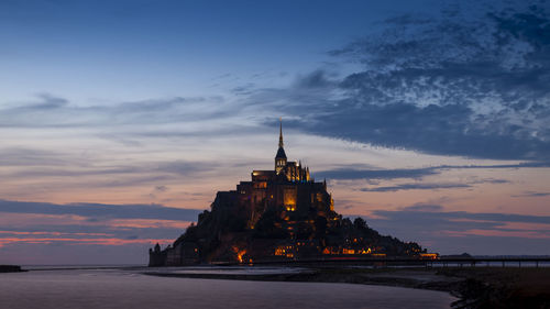 Panoramic view of the famous abbey of le mont saint-michel at sunset, normandy, france