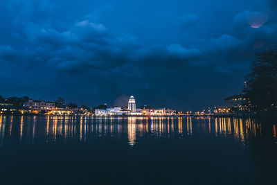 Illuminated city at waterfront