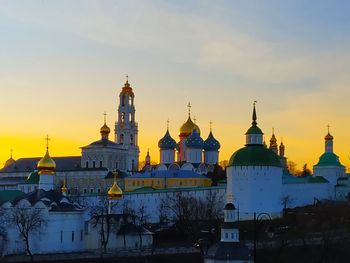 Temple building against sky during sunset