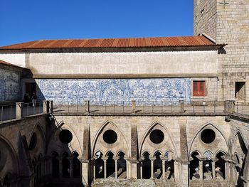 Exterior of old building against clear blue sky