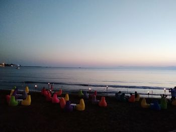 Scenic view of beach against sky during sunset