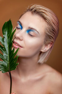 Close-up of young woman with eyes closed