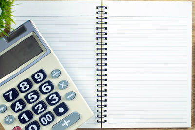 High angle view of white paper on table