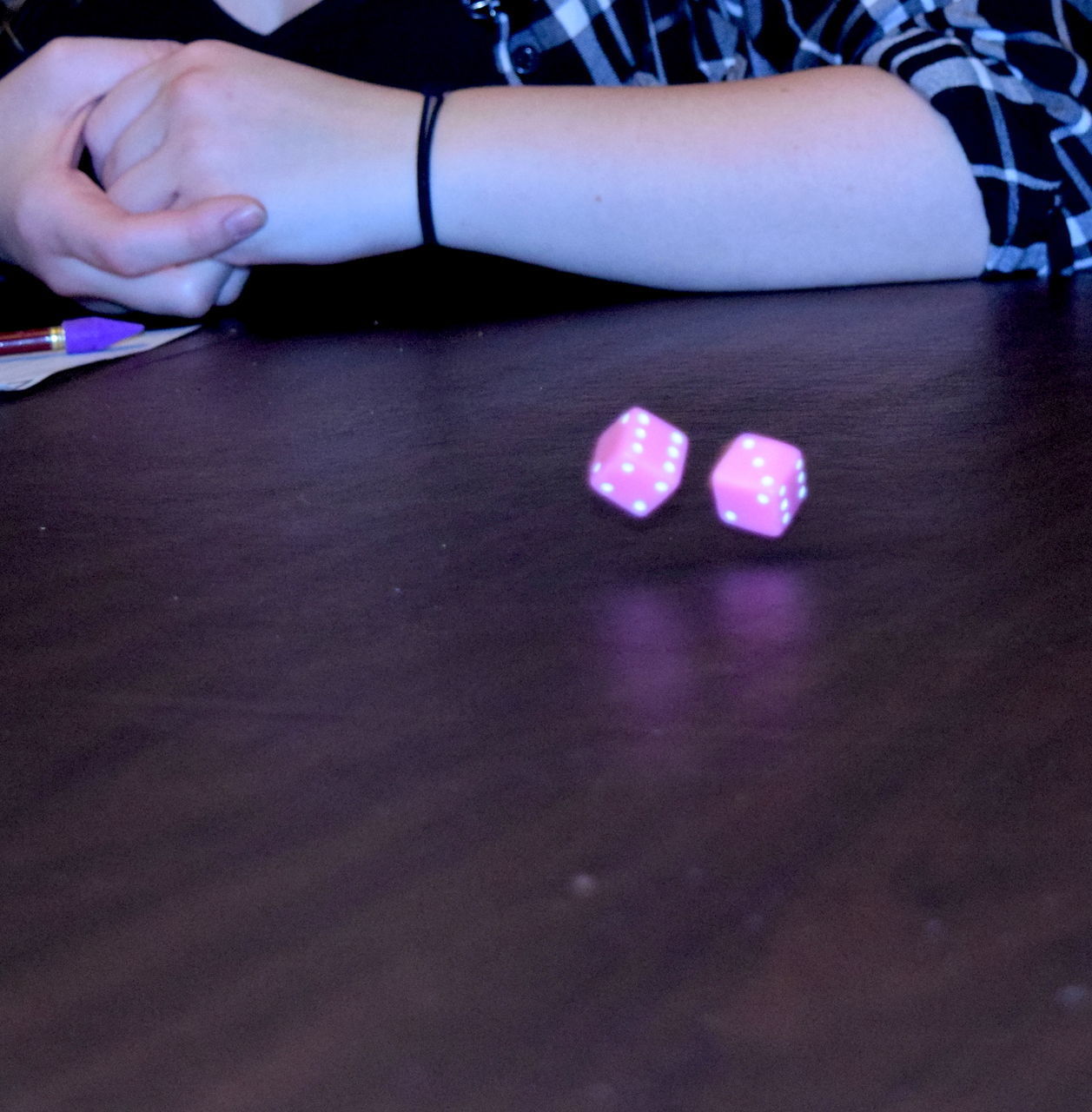 CLOSE-UP OF A HAND ON TABLE