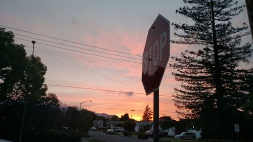 Traffic on road at sunset