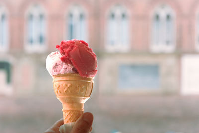 Cropped image of hand holding ice cream