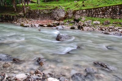 View of river flowing through rocks