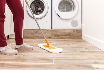 Low section of man standing on floor