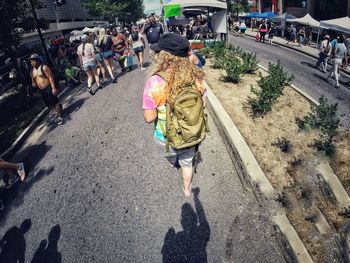 High angle view of people walking on road