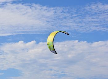 Low angle view of kite flying against sky