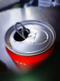 High angle view of coffee cup on metal