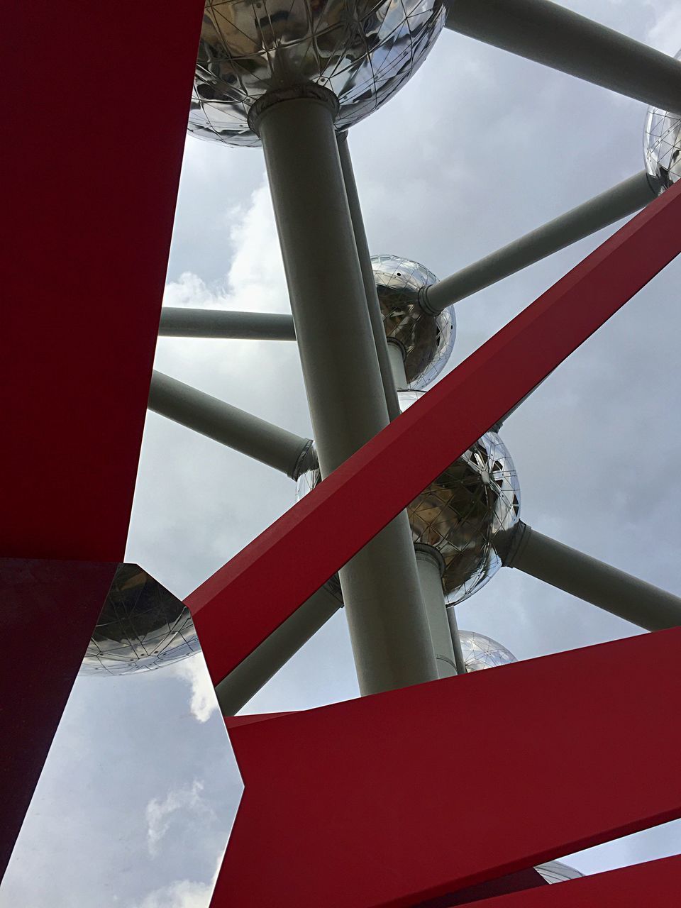 LOW ANGLE VIEW OF METALLIC POLE AGAINST SKY