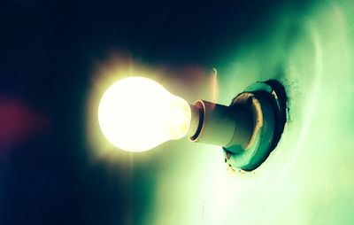 Low angle view of illuminated lamp
