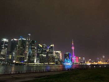 Illuminated buildings in city at night