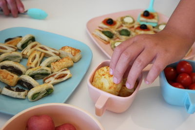 High angle view of woman preparing food on table