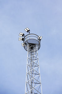 Low angle view of floodlight against blue sky