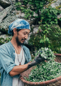 Man working with plants