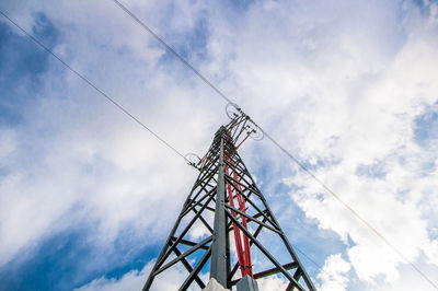 Low angle view of communications tower against sky