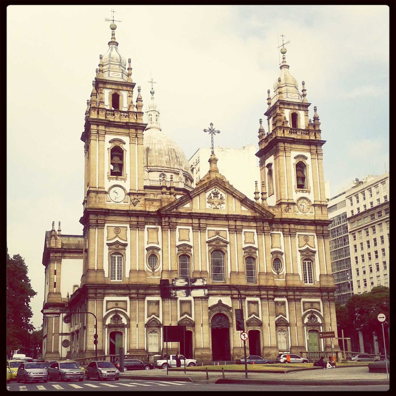 religion, building exterior, church, architecture, place of worship, built structure, spirituality, cathedral, transfer print, low angle view, facade, sky, travel destinations, clock, travel, car, auto post production filter, incidental people