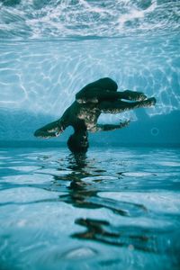 Dancer swimming in pool