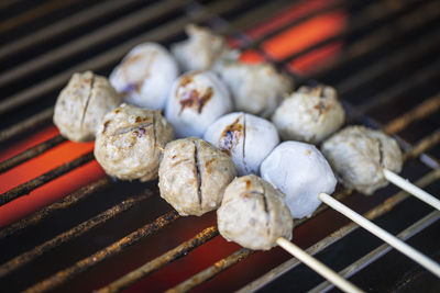 Close-up of meat on barbecue grill