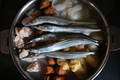 Directly above shot of fish in bowl with food