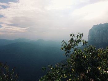 View of calm sea against mountain range