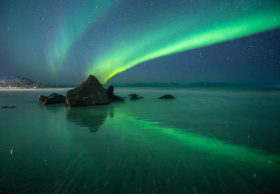 Scenic view of sea against sky at night