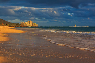 Scenic view of beach against sky during sunset