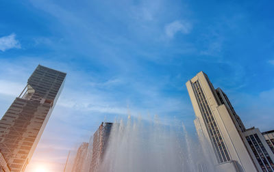 Low angle view of modern buildings against sky