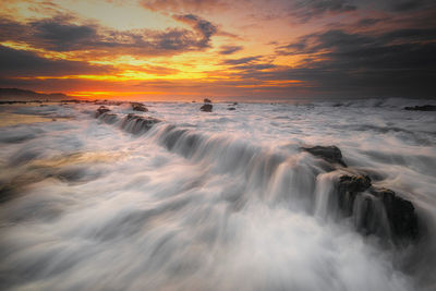 Scenic view of sea against sky during sunset