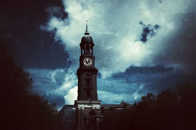 Clock tower against sky at night