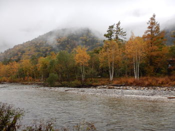 Scenic view of lake against sky during autumn