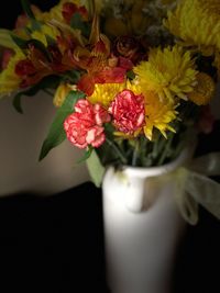 Close-up of red roses in vase