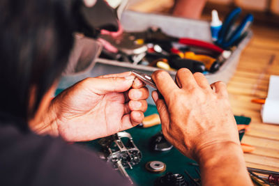 Close-up of man working on table